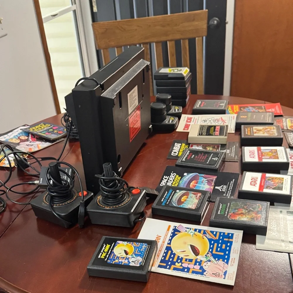 Vintage Authentic Atari 2600 with controllers, games and instruction booklets.